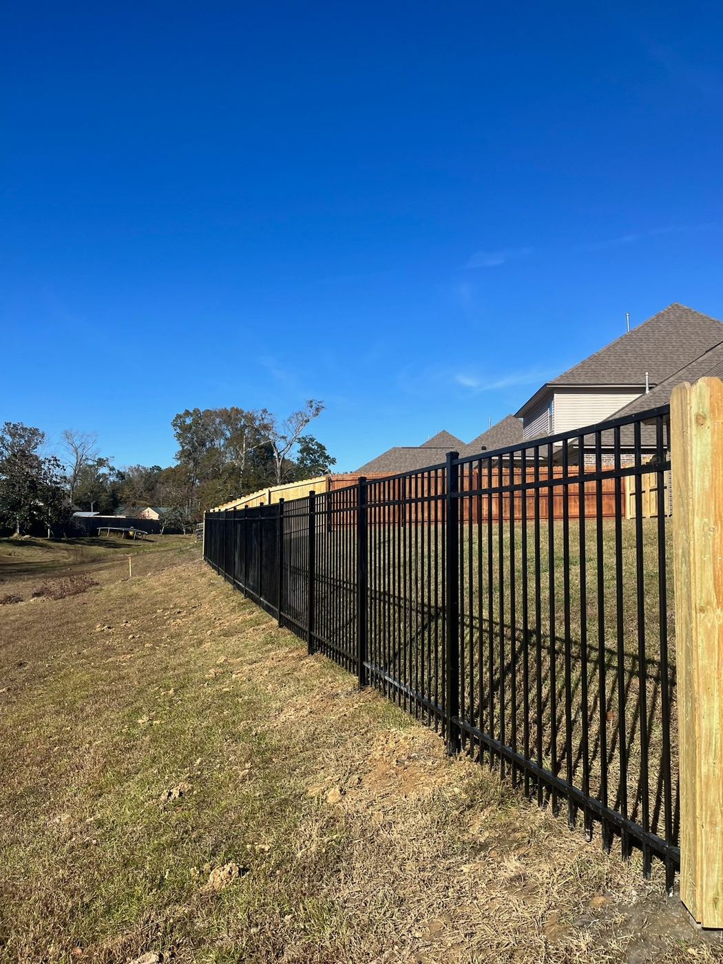 Black aluminum panel fence line