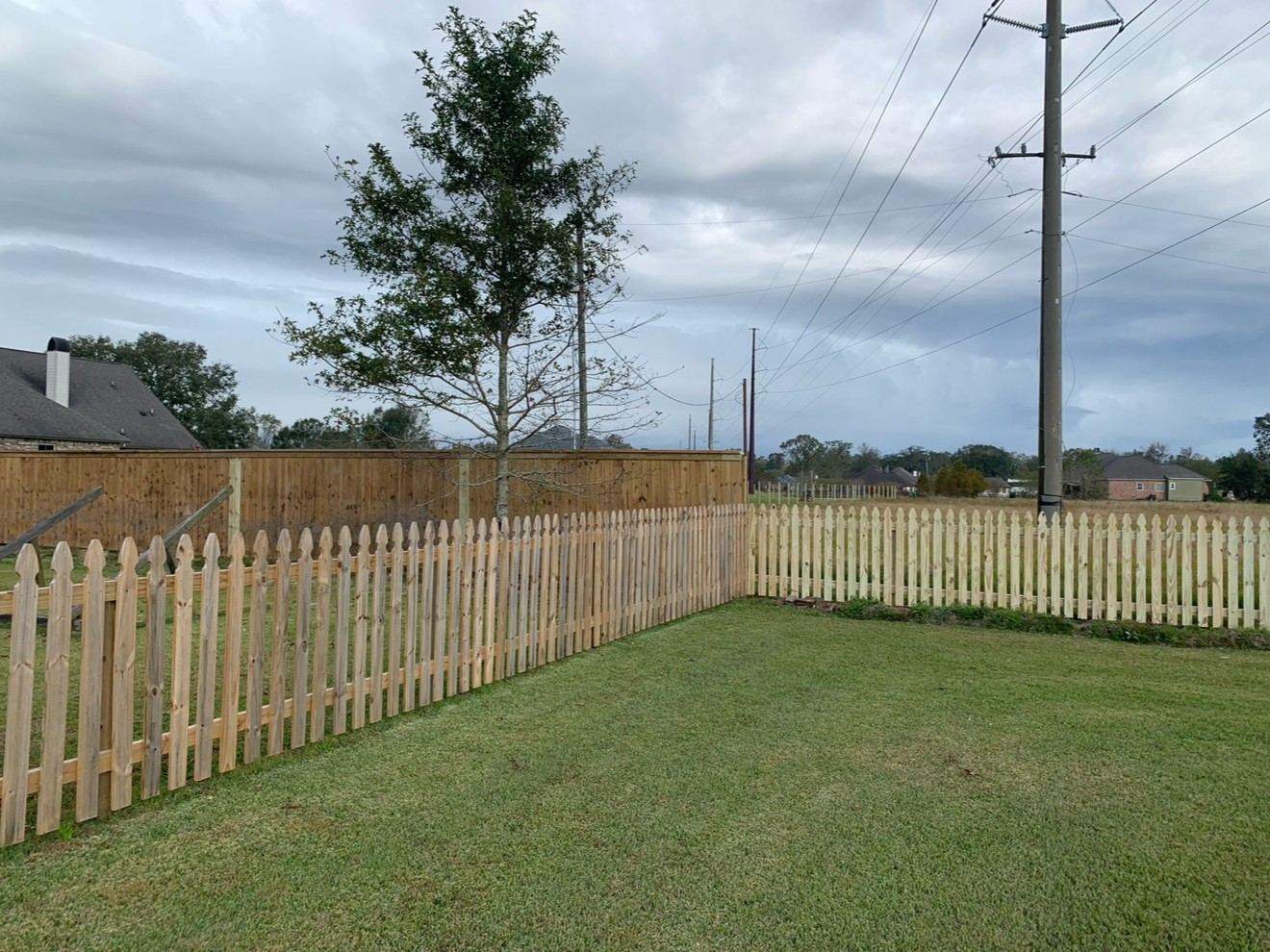 Wood picket fence styles side by side